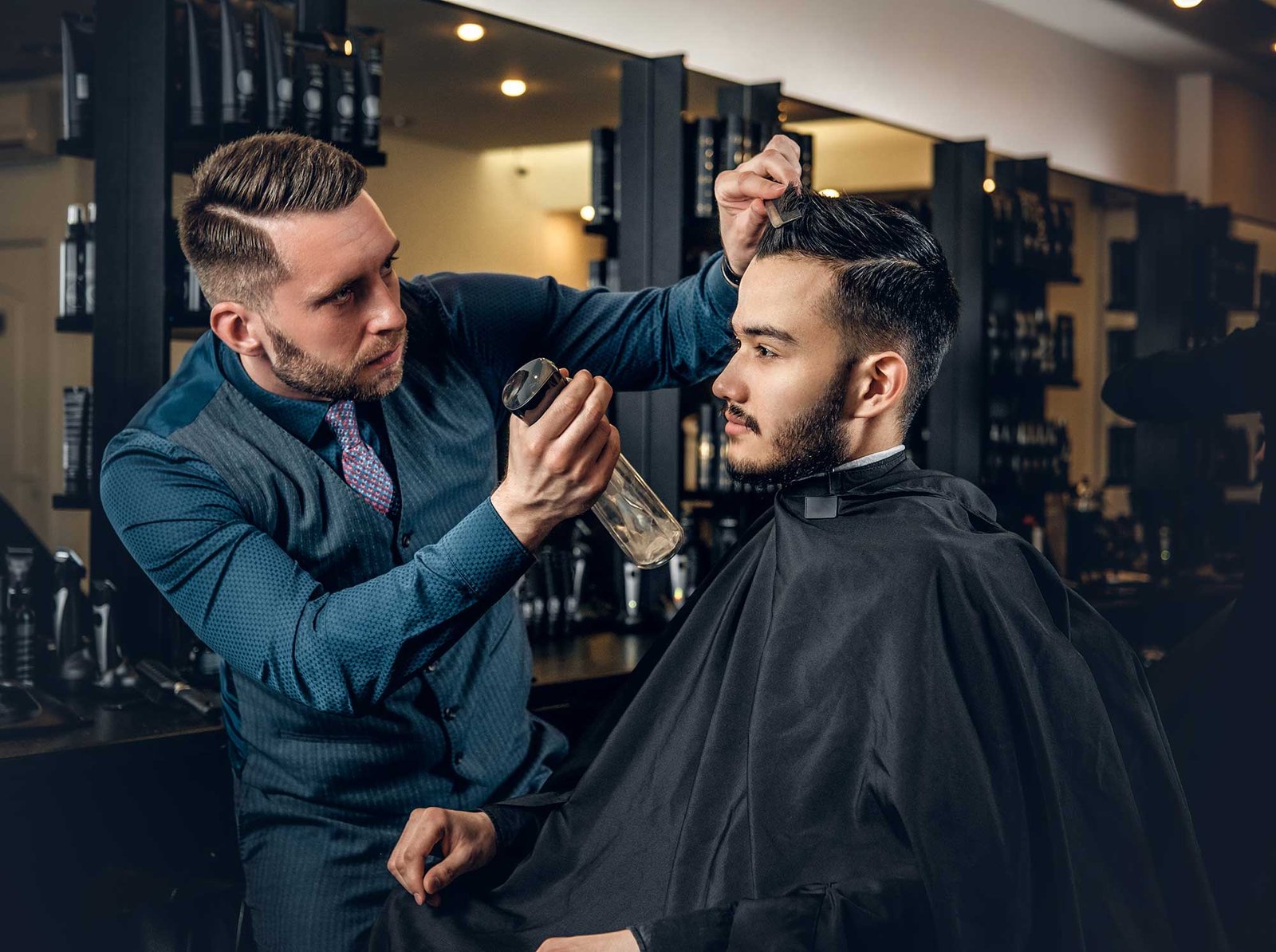 hairdresser-doing-haircut-to-a-bearded-man-in-a-ba-2021-08-28-17-38-11-utc-2.jpg