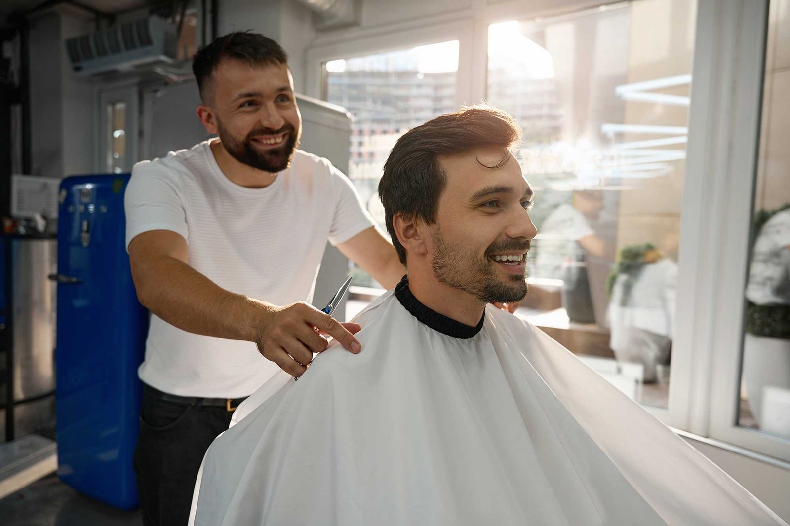 happy-male-client-of-hair-salon-looking-contented-2022-09-28-23-13-57-utc-2.jpg