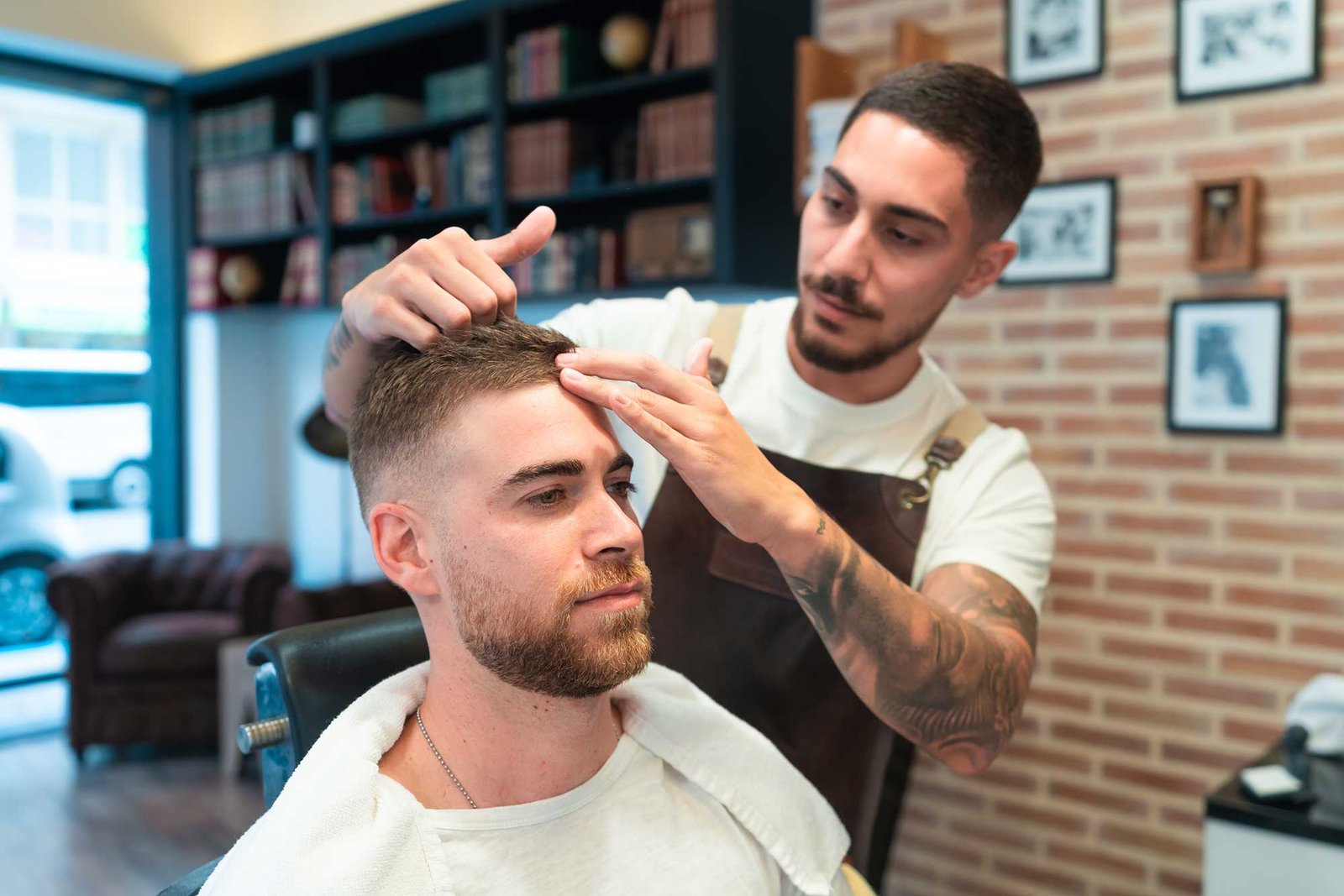 young-hairdresser-with-tattoos-styling-the-male-cu-2023-01-18-19-36-34-utc-2.jpg